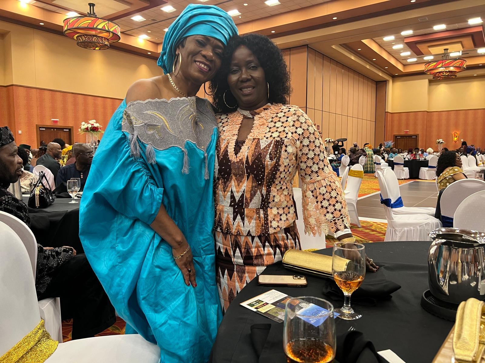 Two CEANA 2024 guests standing together in formal attire