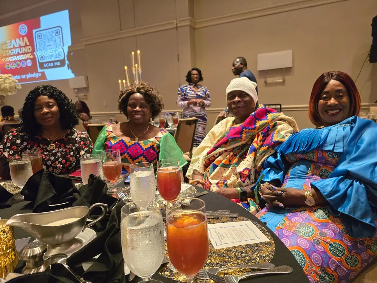 Four Ewe Association women seated together at a CEANA convention dinner