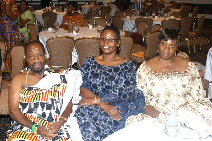 Association members seated together at a community event
